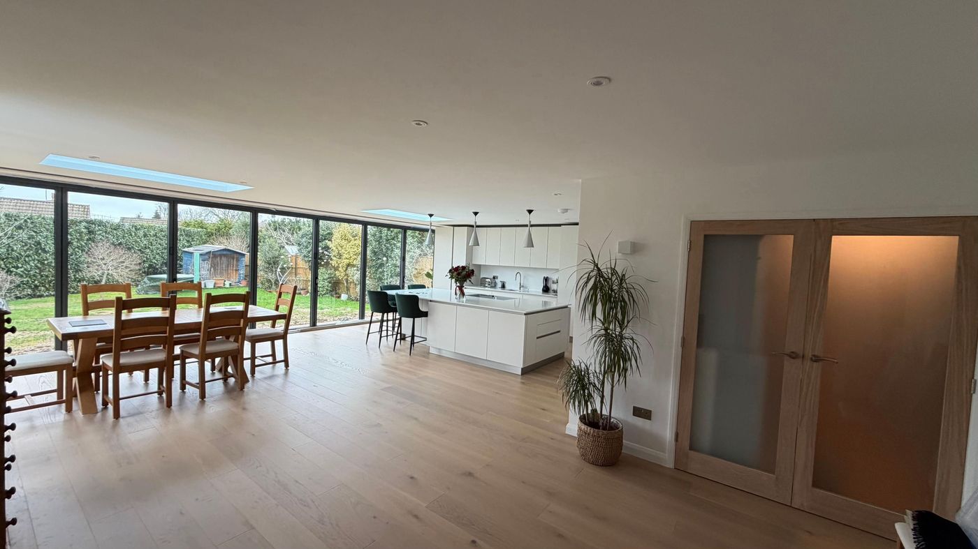 Open plan dining room with garden views