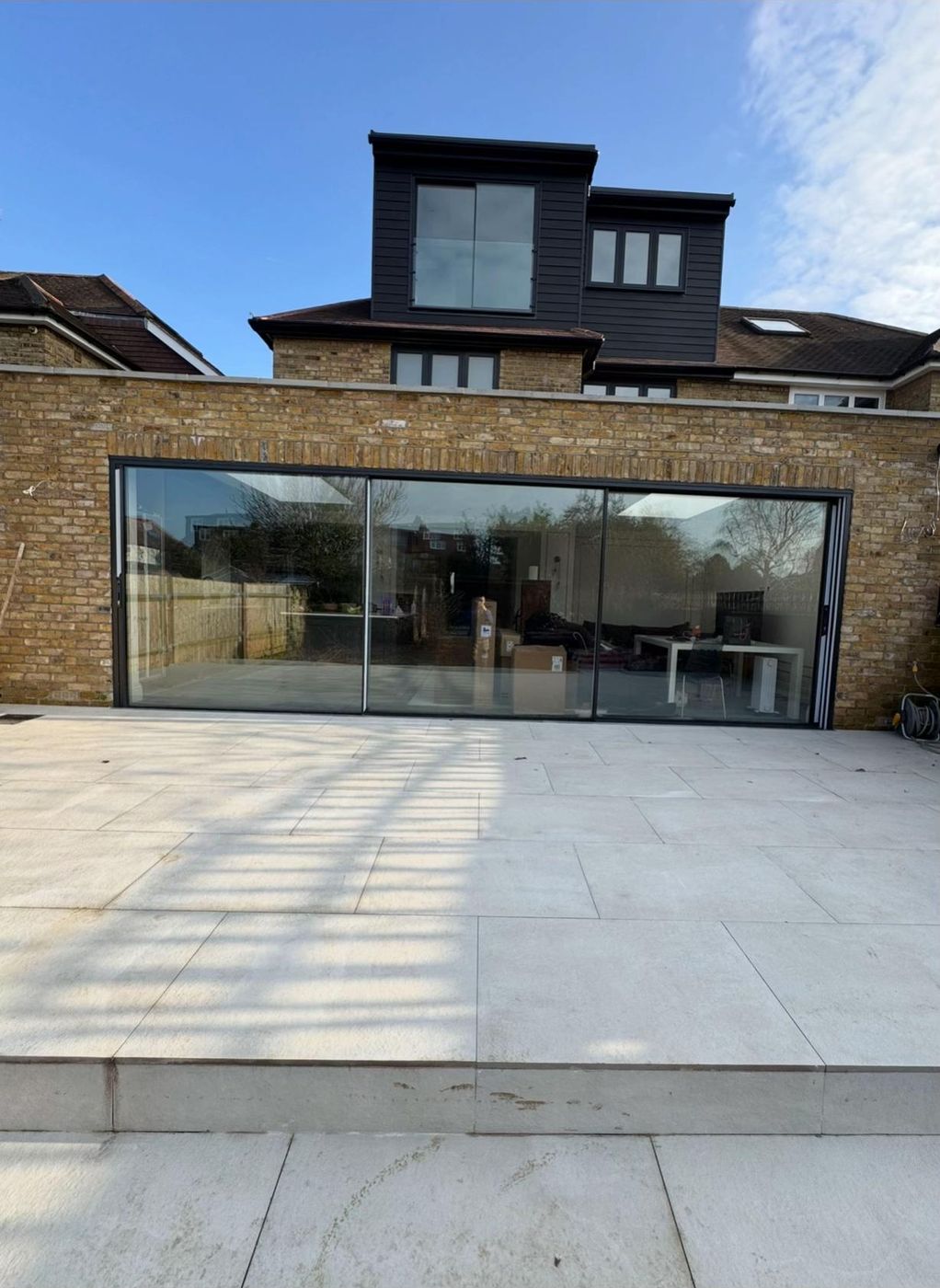 Finished clad dormer loft conversion with glass Juliet doors
