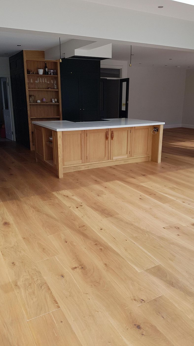 Kitchen with oak island and dark cabinetry