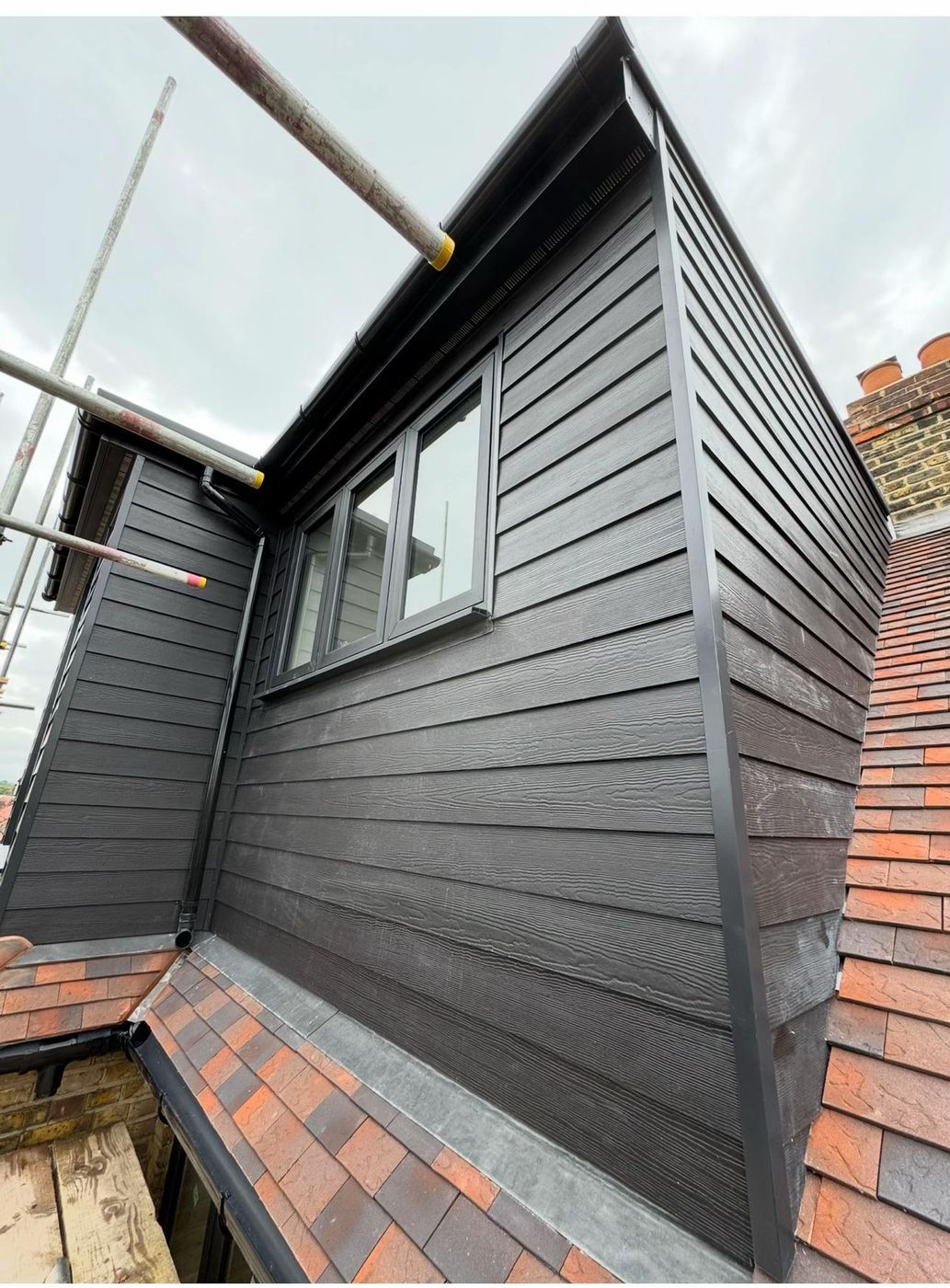 Clad dormer on a tiled roof