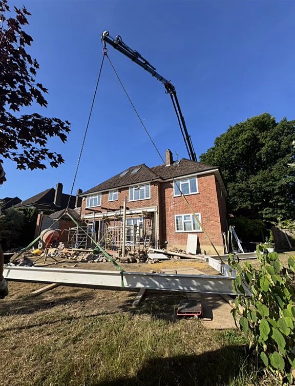 Crane lifting steels into place