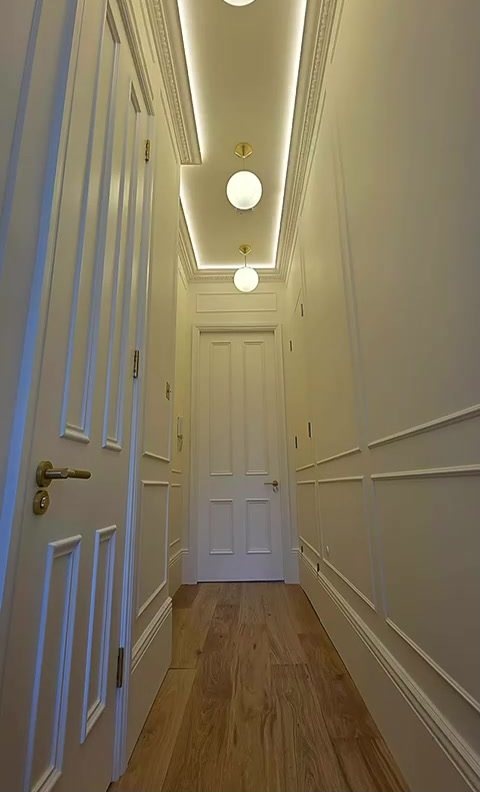 Finished panelled hallway with oak floor